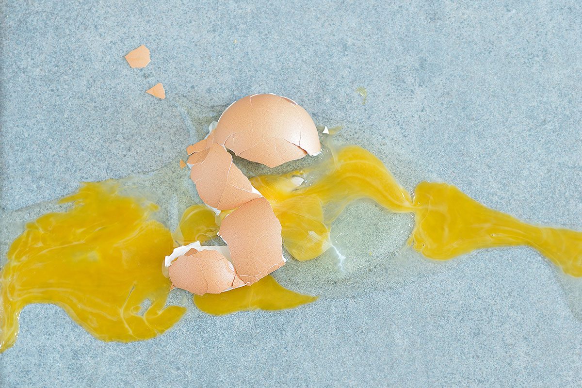 broken egg on the kitchen floor