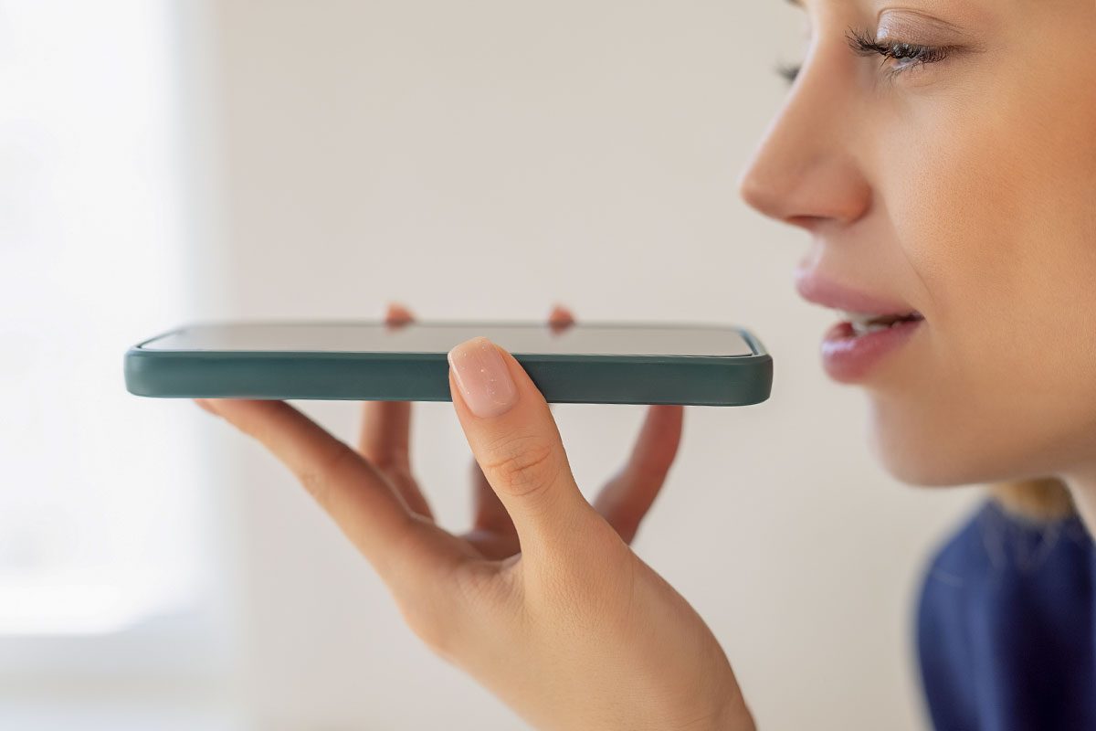 Woman recording voice memo on phone