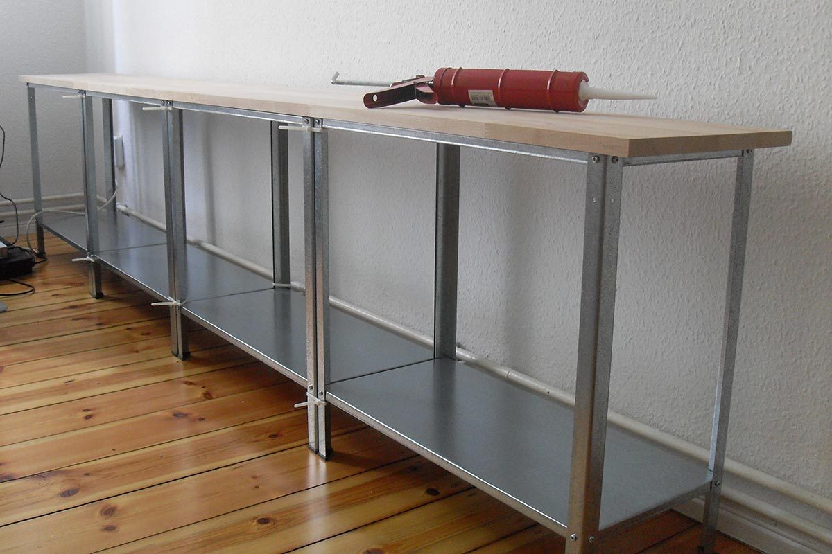 Four butcher blocks arranged together against a wall