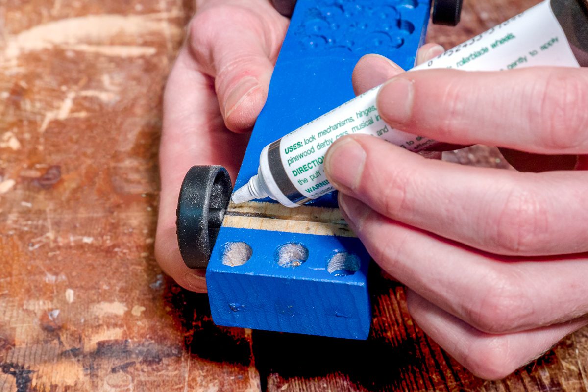 applying graphite lubricant to car wheel