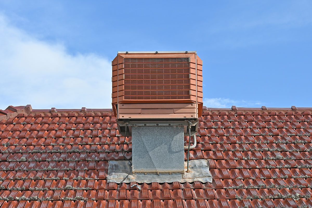 Evaporative air conditioner at roof of the house