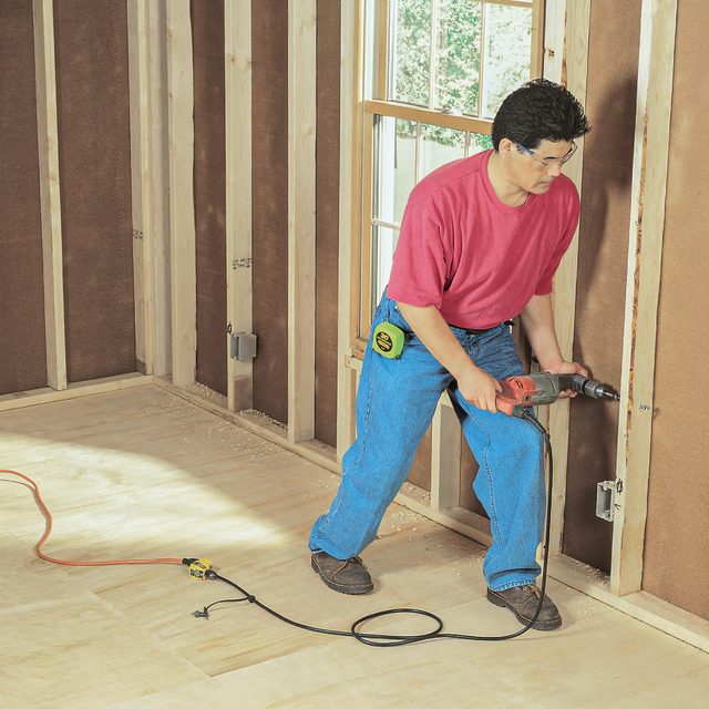 Drill holes in the framing