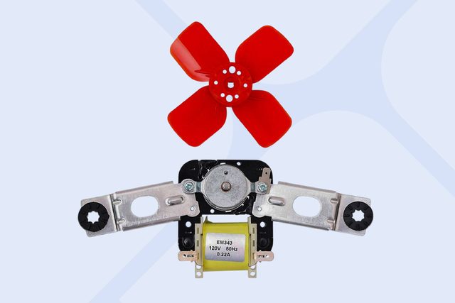 A red plastic fan blade rests above a metallic motor assembly, which includes a yellow coil labeled "EM343 120V 60Hz 0.22A," indicating electrical specifications.