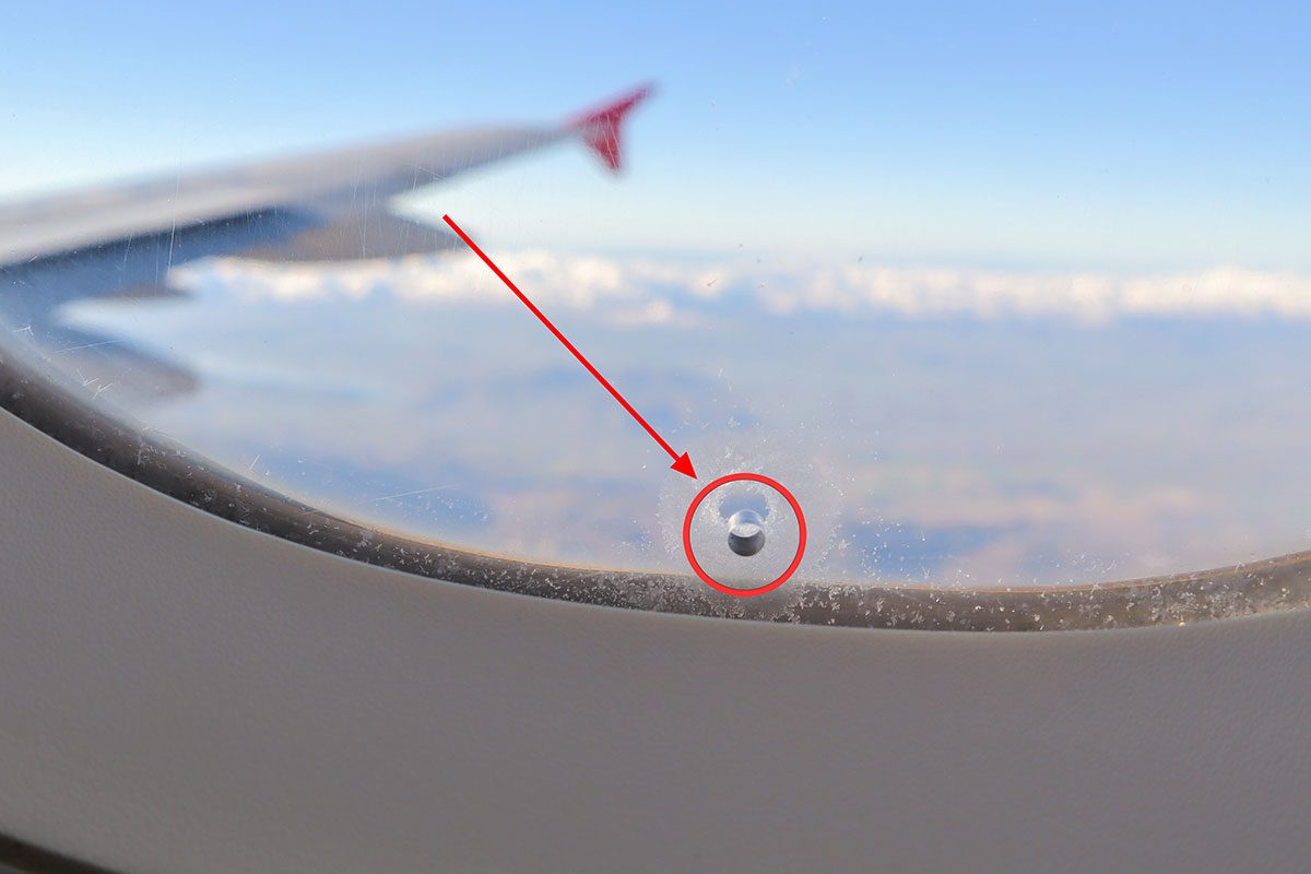 Here’s What That Tiny Hole In Airplane Windows Is Actually For