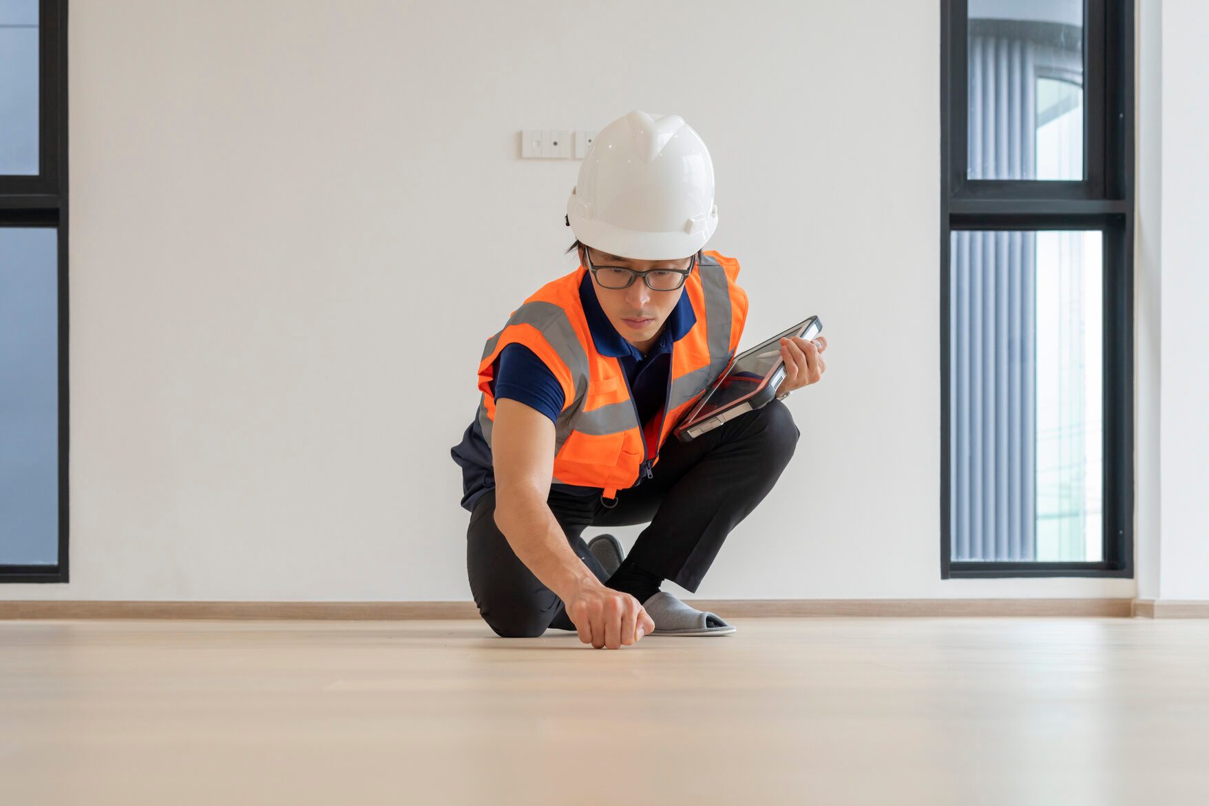 Japanese Man inspecting house interior.