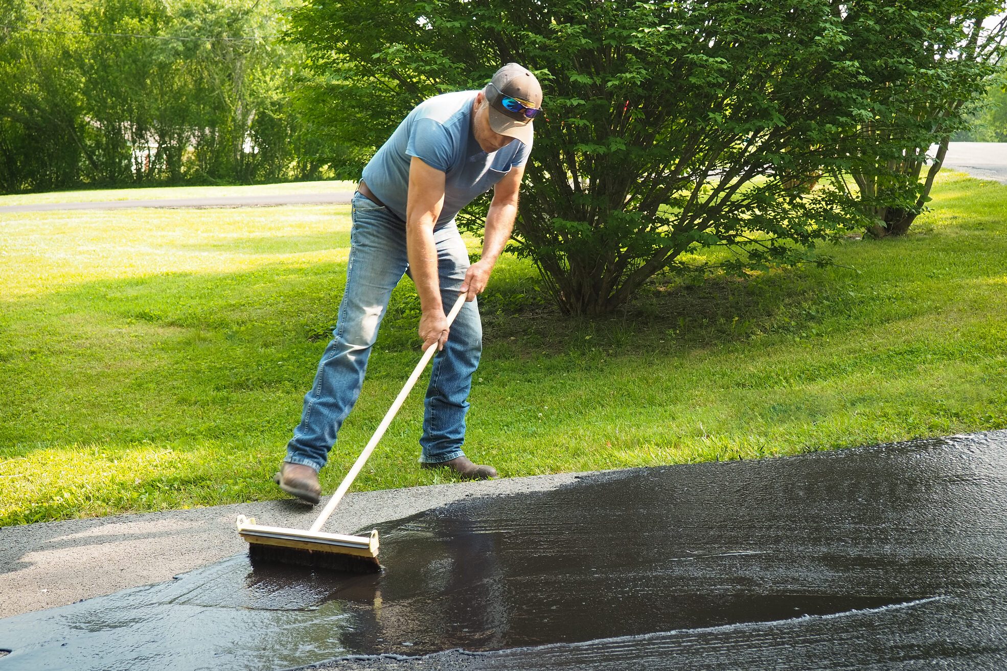 Man sealing driveway