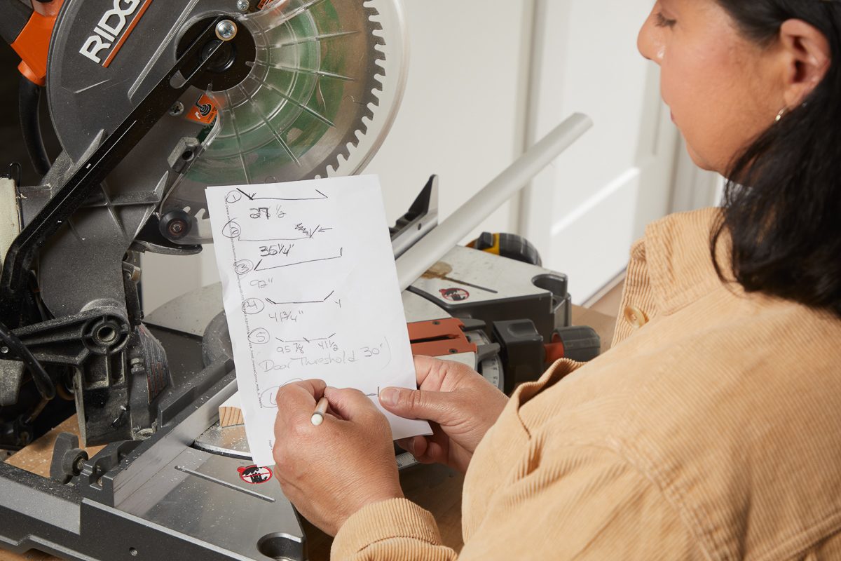 woman writing on a piece of paper