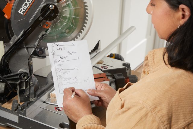 woman writing on a piece of paper