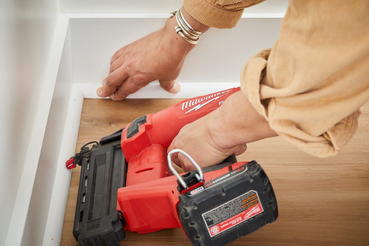 nailing pieces of quarter-round