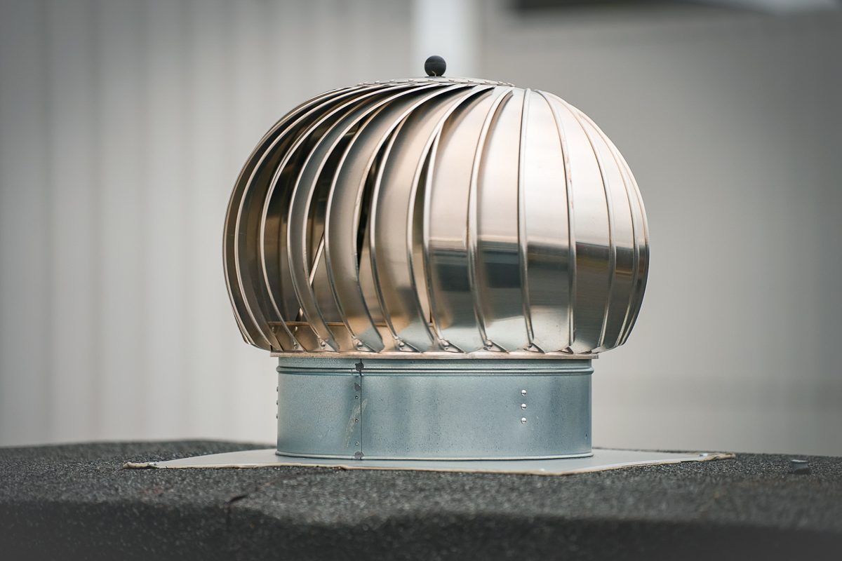 rotary deflector on house rooftop