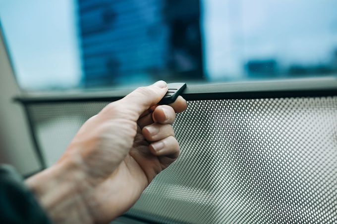 Hand hold car side window curtains sunshades. Insect screen at the car