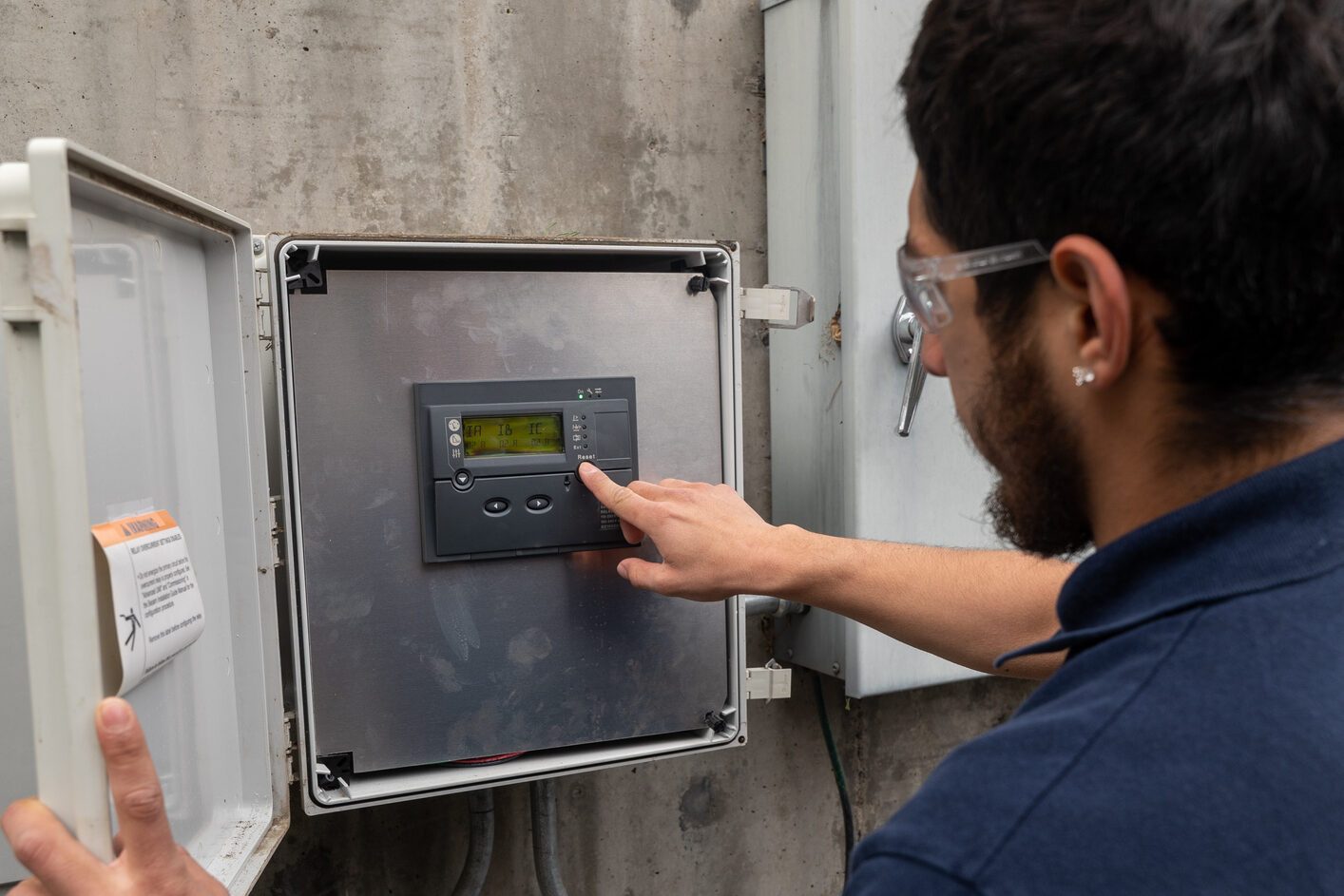 Engineer doing maintenance on energy efficient house