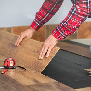 Worker Hands Installing Timber Laminate Floor In The Room Gettyimages 1303273331 Ft