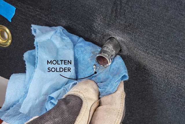 Clean excess solder from valve