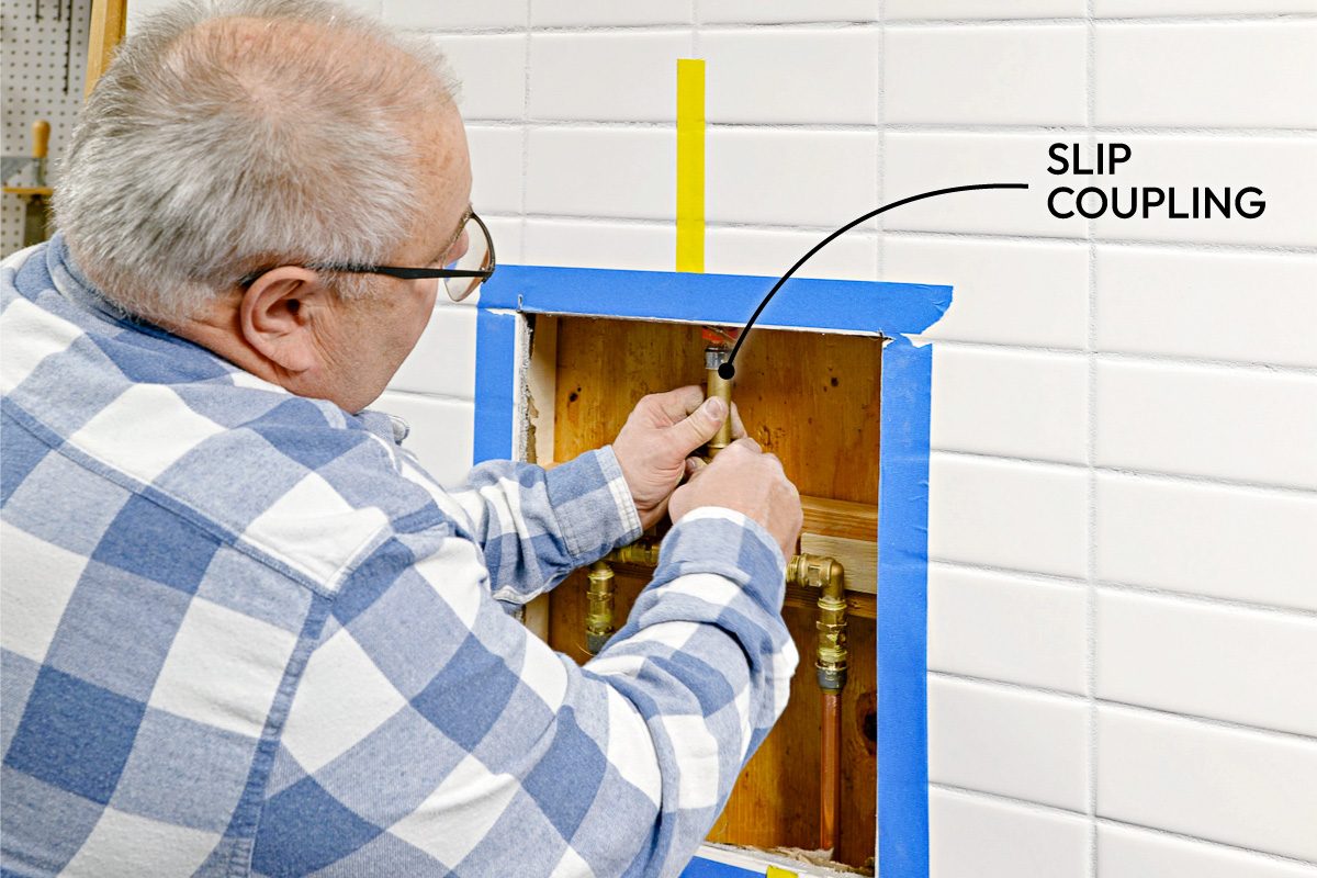 man connecting shower line