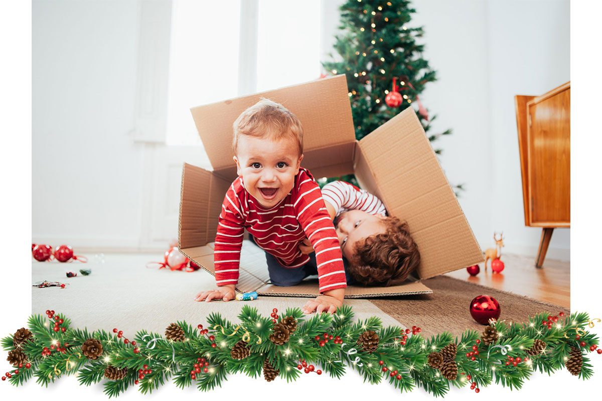 Siblings decorating the Christmas tree